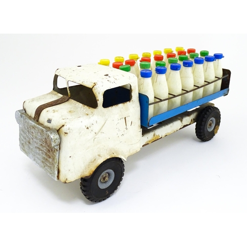 1320 - Toys: A tinplate Tri-ang Hi-way Milk Float / truck with milk bottles. Approx. 13 3/4