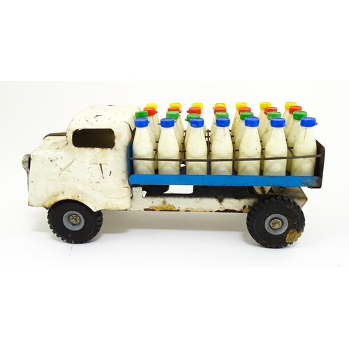 1320 - Toys: A tinplate Tri-ang Hi-way Milk Float / truck with milk bottles. Approx. 13 3/4