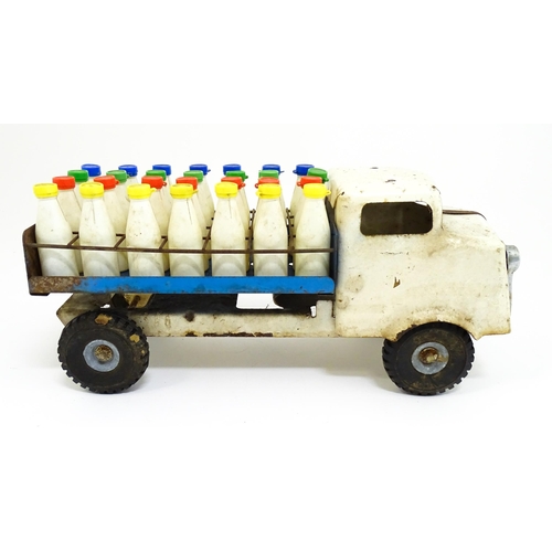1320 - Toys: A tinplate Tri-ang Hi-way Milk Float / truck with milk bottles. Approx. 13 3/4
