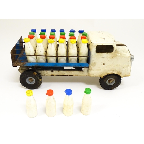 1320 - Toys: A tinplate Tri-ang Hi-way Milk Float / truck with milk bottles. Approx. 13 3/4
