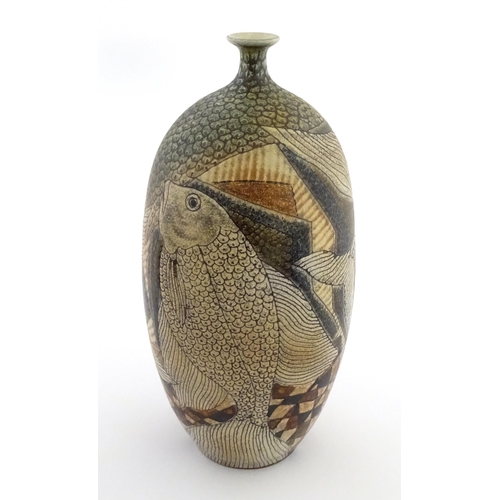A Spanish studio pottery vase by Manuel Millet Lopez decorated with fish and geometric shapes. Signed and dated 87 to body and under. Approx. 14" high