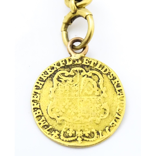 793 - An 18ct gold Albert watch chain with George II guinea coin formed fob. Chain approx. 15