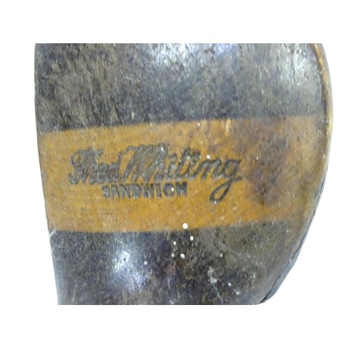 8 - A mid 20thC golf bag and clubs, including three hardwood drivers stamped 'Fred Whitting - Sandwich',... 