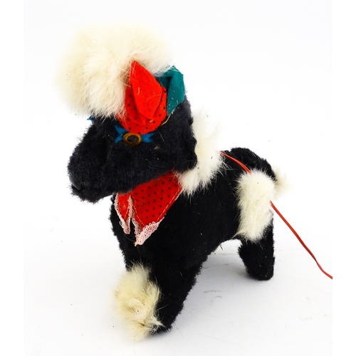 14 - Toy: A 20thC Cragstan battery operated toy dog titled Jumping Princess Poodle. With box. Approx. 8 1... 