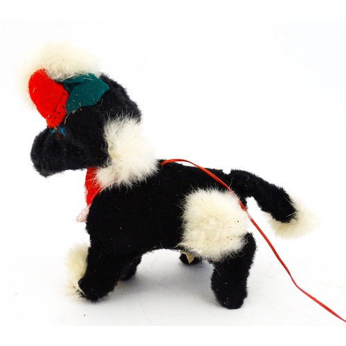 14 - Toy: A 20thC Cragstan battery operated toy dog titled Jumping Princess Poodle. With box. Approx. 8 1... 