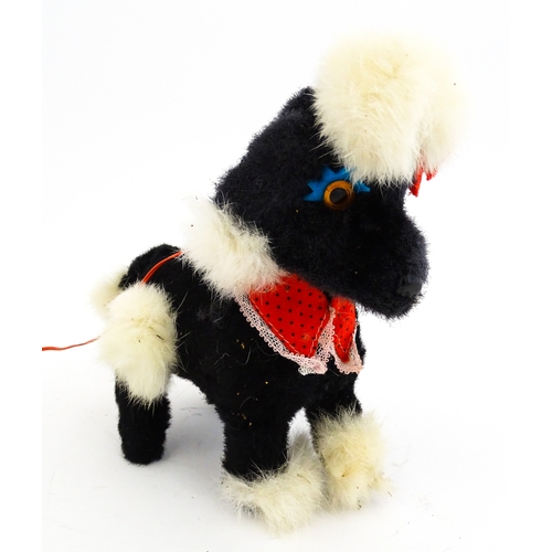 14 - Toy: A 20thC Cragstan battery operated toy dog titled Jumping Princess Poodle. With box. Approx. 8 1... 