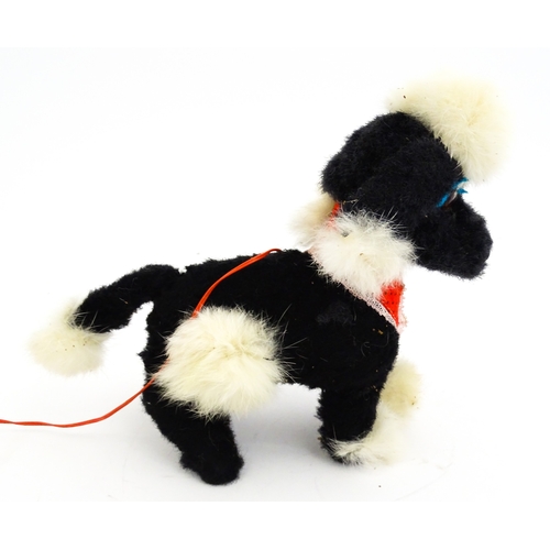 14 - Toy: A 20thC Cragstan battery operated toy dog titled Jumping Princess Poodle. With box. Approx. 8 1... 