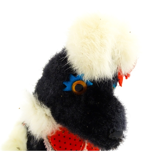 14 - Toy: A 20thC Cragstan battery operated toy dog titled Jumping Princess Poodle. With box. Approx. 8 1... 