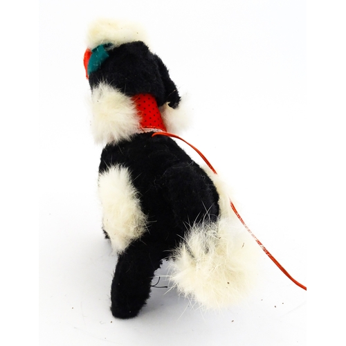 14 - Toy: A 20thC Cragstan battery operated toy dog titled Jumping Princess Poodle. With box. Approx. 8 1... 