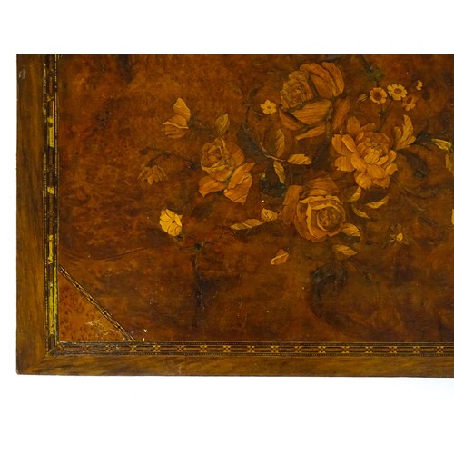 16 - A 20thC marquetry panel with inlaid rose and flower decoration. Approx. 15 3/4