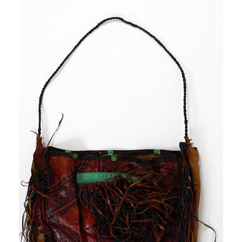 20 - Ethnographic / Native / Tribal : A Tuareg style leather camel bag with dyed panel detail, geometric ... 