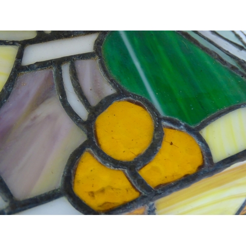 27 - A stained glass pendant light shade, in the Tiffany style. Approx. 26