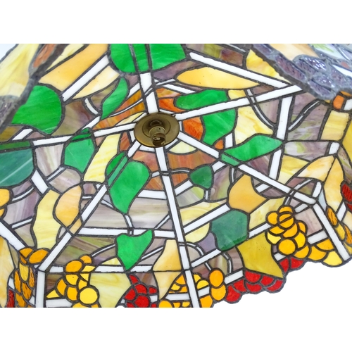 27 - A stained glass pendant light shade, in the Tiffany style. Approx. 26