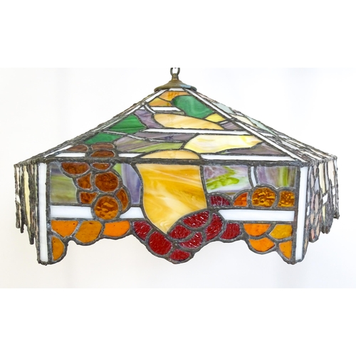 27 - A stained glass pendant light shade, in the Tiffany style. Approx. 26