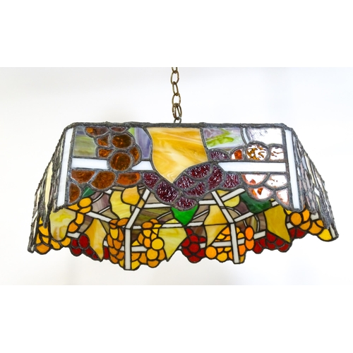 27 - A stained glass pendant light shade, in the Tiffany style. Approx. 26
