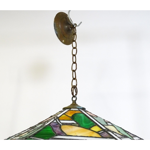 27 - A stained glass pendant light shade, in the Tiffany style. Approx. 26