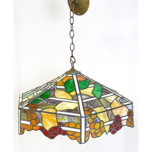 27 - A stained glass pendant light shade, in the Tiffany style. Approx. 26