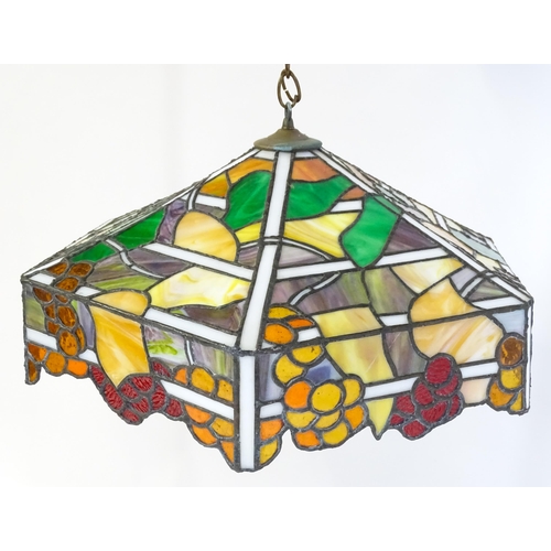 27 - A stained glass pendant light shade, in the Tiffany style. Approx. 26