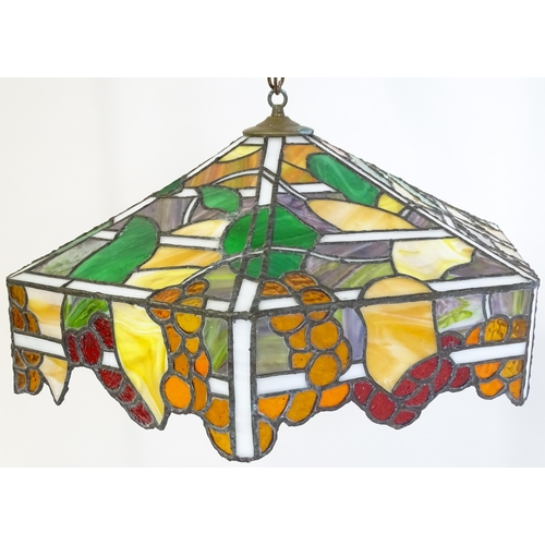 27 - A stained glass pendant light shade, in the Tiffany style. Approx. 26