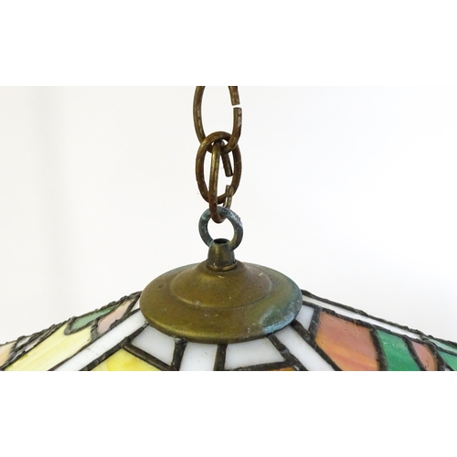 27 - A stained glass pendant light shade, in the Tiffany style. Approx. 26