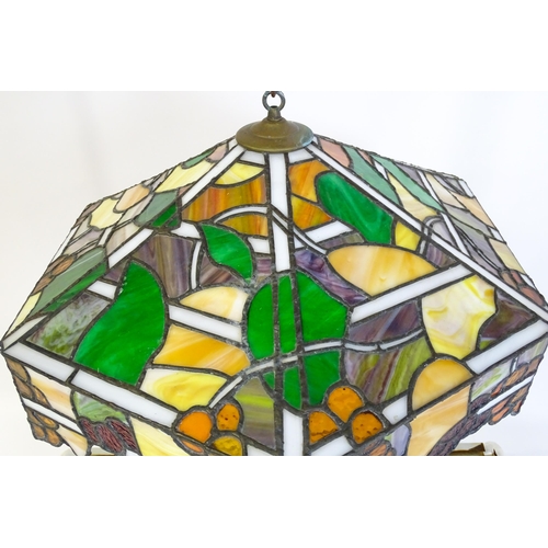 27 - A stained glass pendant light shade, in the Tiffany style. Approx. 26