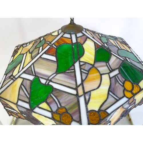 27 - A stained glass pendant light shade, in the Tiffany style. Approx. 26