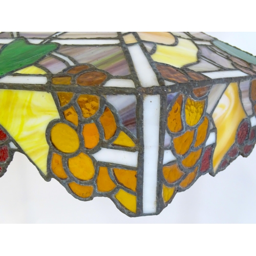 27 - A stained glass pendant light shade, in the Tiffany style. Approx. 26
