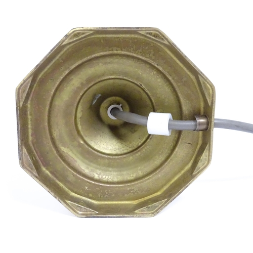 40 - A 20thC brass table lamp raised on an octagonal base. Approx. 12 1/2