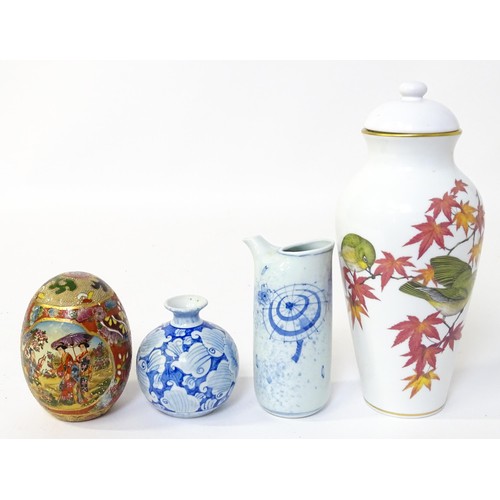 42 - Four ceramic items comprising a Franklin porcelain Japan vase and cover decorated with birds and lea... 
