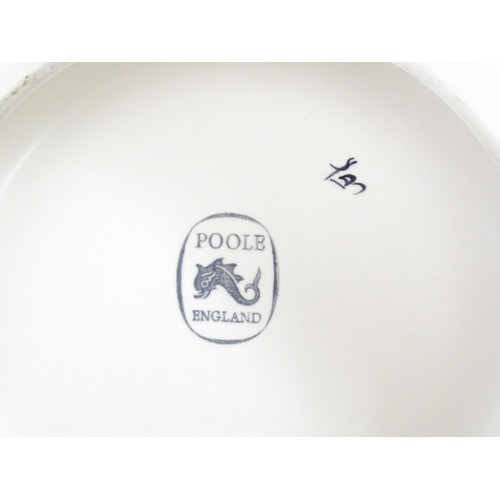 47 - Three items of Poole Pottery to include a bowl, and two vases of flared, waisted form. Tallest appro... 