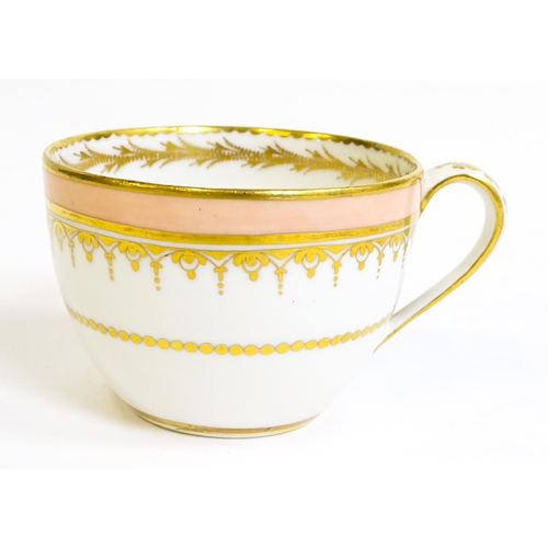 49 - A Derby tea cup and saucer with gilt detail. Bearing hand painted marks under. Cup approx. 2 1/4