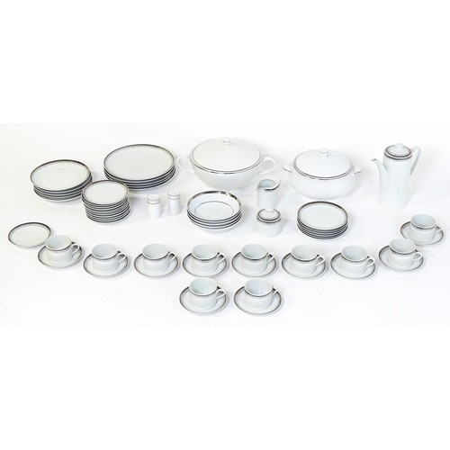 53 - A quantity of assorted dinner wares to include plates, tureens, coffee pot, cups, saucers, bowls, et... 