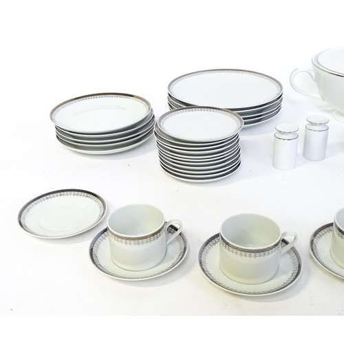 53 - A quantity of assorted dinner wares to include plates, tureens, coffee pot, cups, saucers, bowls, et... 