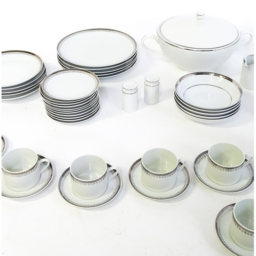53 - A quantity of assorted dinner wares to include plates, tureens, coffee pot, cups, saucers, bowls, et... 