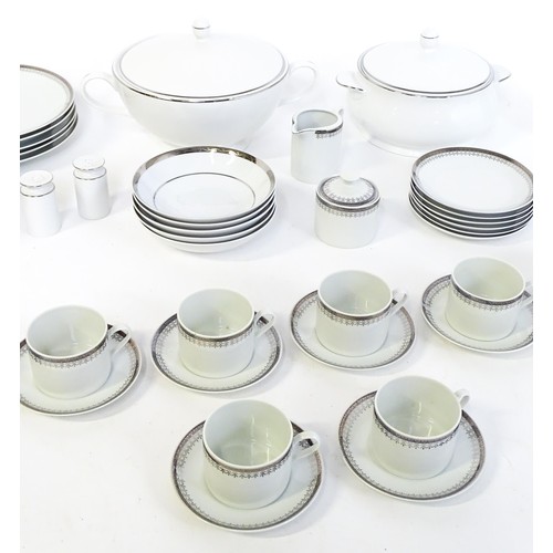 53 - A quantity of assorted dinner wares to include plates, tureens, coffee pot, cups, saucers, bowls, et... 