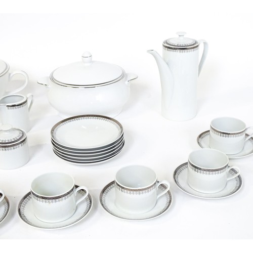 53 - A quantity of assorted dinner wares to include plates, tureens, coffee pot, cups, saucers, bowls, et... 
