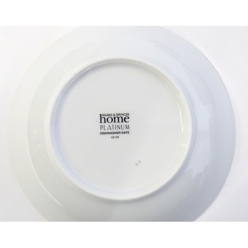 53 - A quantity of assorted dinner wares to include plates, tureens, coffee pot, cups, saucers, bowls, et... 