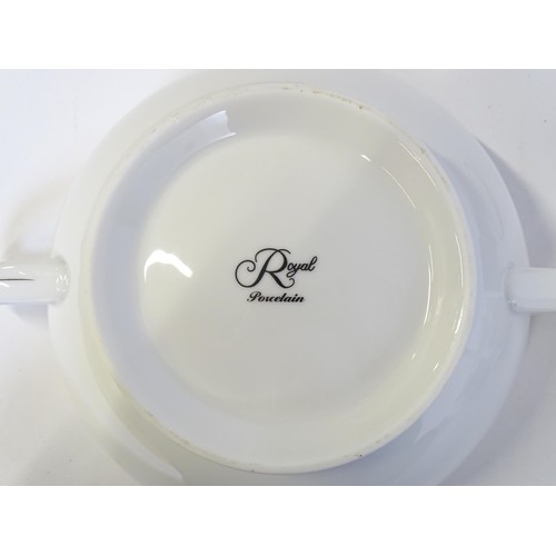 53 - A quantity of assorted dinner wares to include plates, tureens, coffee pot, cups, saucers, bowls, et... 