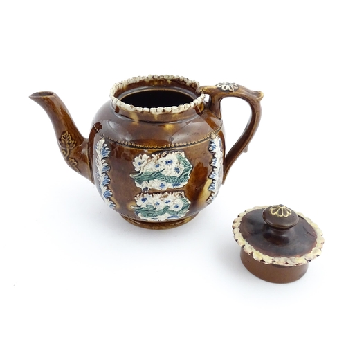 58 - Three items of Victorian Measham bargeware comprising a teapot decorated with birds and flowers with... 