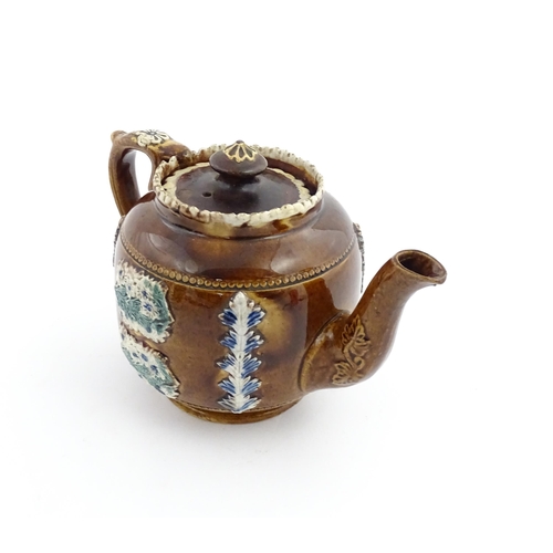 58 - Three items of Victorian Measham bargeware comprising a teapot decorated with birds and flowers with... 