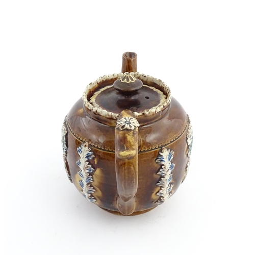 58 - Three items of Victorian Measham bargeware comprising a teapot decorated with birds and flowers with... 