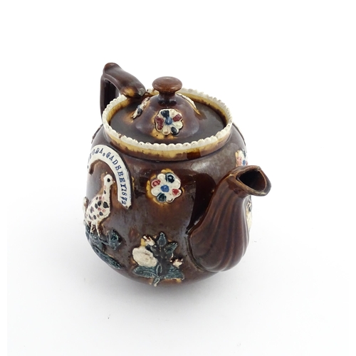 58 - Three items of Victorian Measham bargeware comprising a teapot decorated with birds and flowers with... 