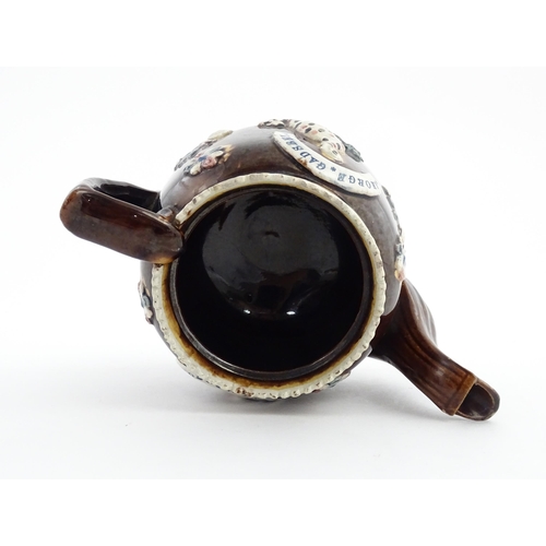 58 - Three items of Victorian Measham bargeware comprising a teapot decorated with birds and flowers with... 