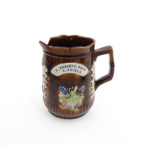 58 - Three items of Victorian Measham bargeware comprising a teapot decorated with birds and flowers with... 