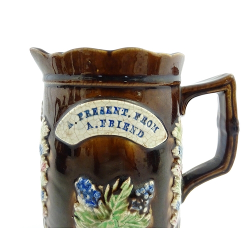 58 - Three items of Victorian Measham bargeware comprising a teapot decorated with birds and flowers with... 