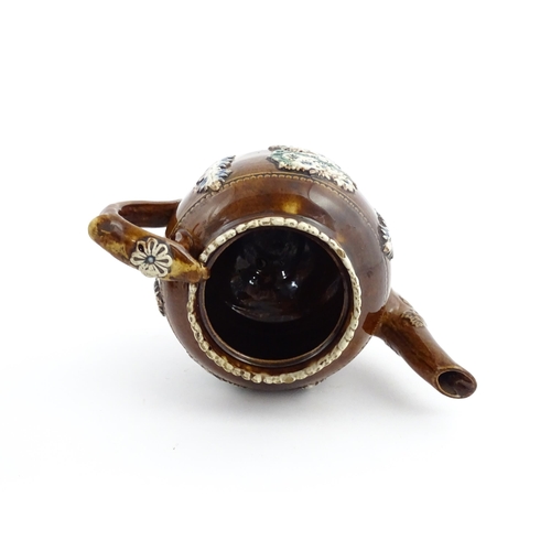 58 - Three items of Victorian Measham bargeware comprising a teapot decorated with birds and flowers with... 