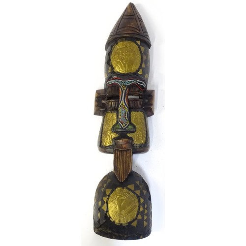 59 - Ethnographic / Native / Tribal : Three African carved masks with painted detail. Together with a car... 