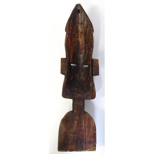 59 - Ethnographic / Native / Tribal : Three African carved masks with painted detail. Together with a car... 