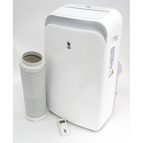 30 - A Pump House air conditioning unit with remote control and hose. Together with a Homebase air condit... 