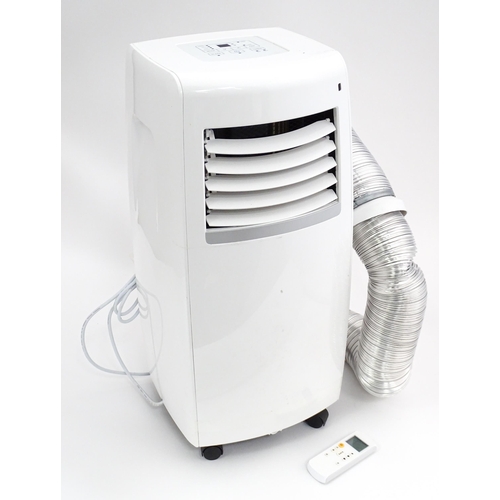 30 - A Pump House air conditioning unit with remote control and hose. Together with a Homebase air condit... 